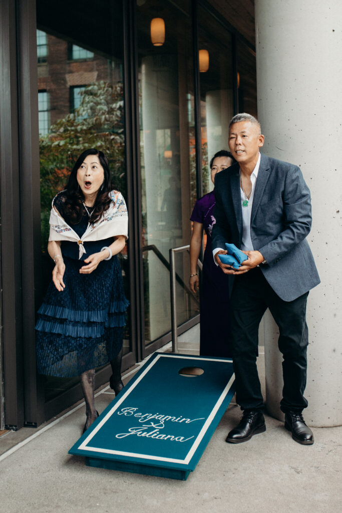 Wedding guests playing games at a Celestine DUMBO wedding reception 