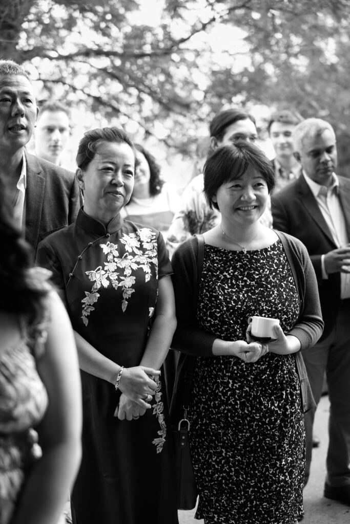 Wedding guests reacting to the couple speaking at a Celestine DUMBO wedding reception