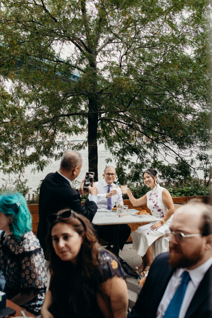 Brooklyn couple and wedding guests interacting at a Celestine DUMBO wedding reception 