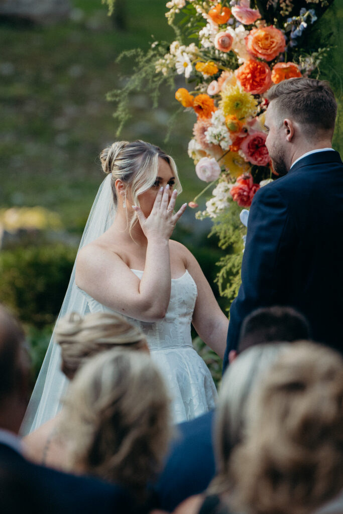 New York bride crying at Arrow Park wedding ceremony