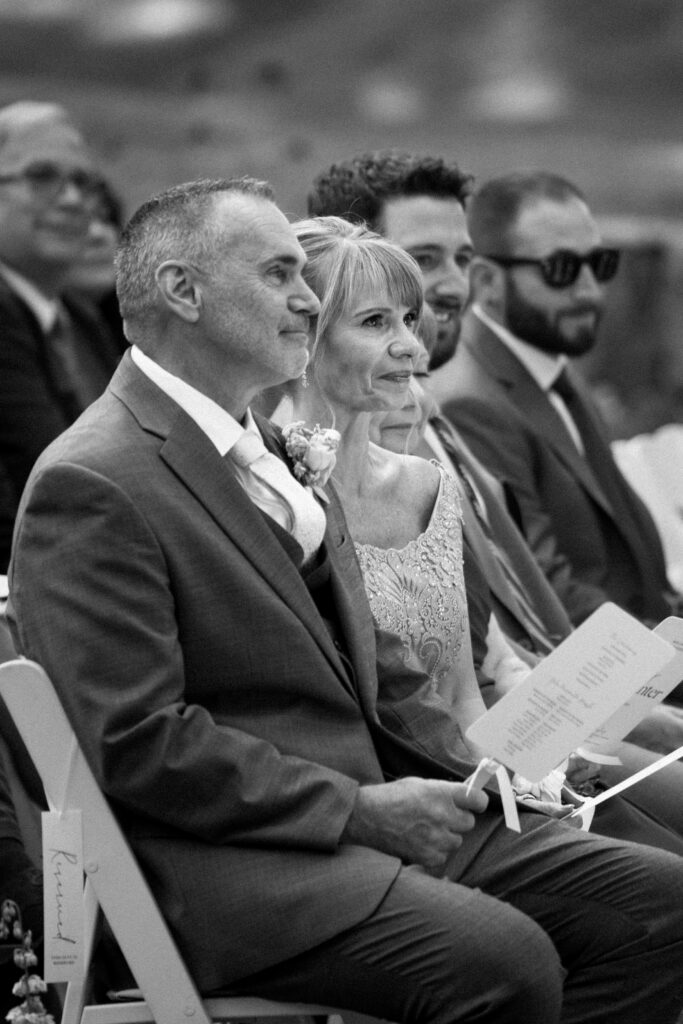 Parents of the couple sitting at Arrow Park wedding ceremony