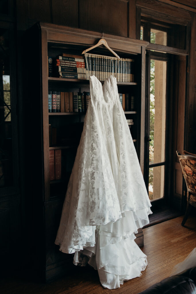 Wedding dress hanging on a bookshelf at Arrow Park New York