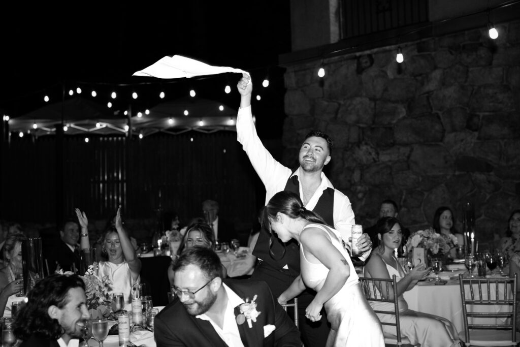 Wedding guest standing up at Arrow Park wedding reception