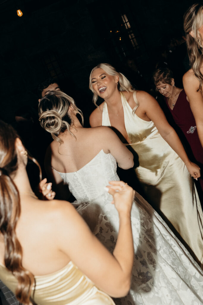 New York bride and bridesmaids dancing at Arrow Park wedding reception
