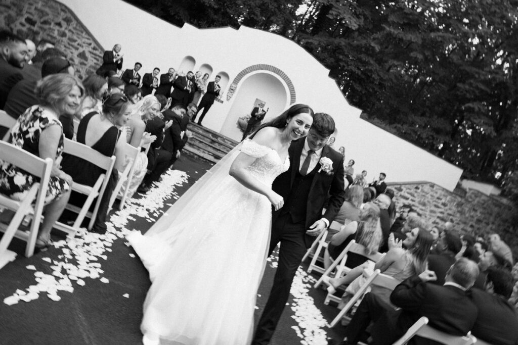 New York couple walking down the aisle at The Willows wedding ceremony