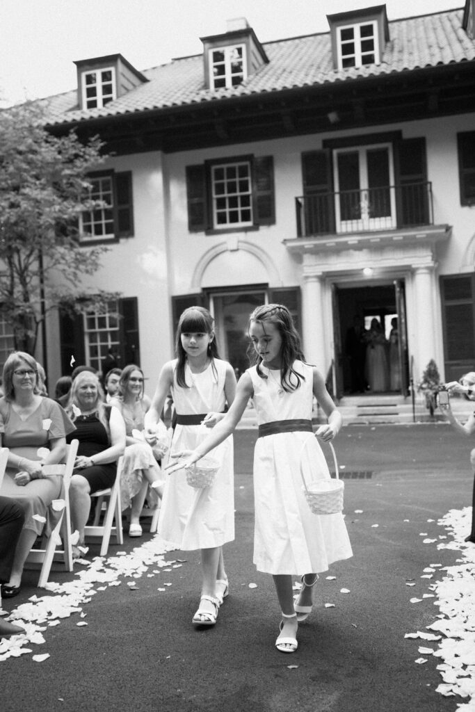 New York flower girls walking down the aisle at The Willows wedding ceremony