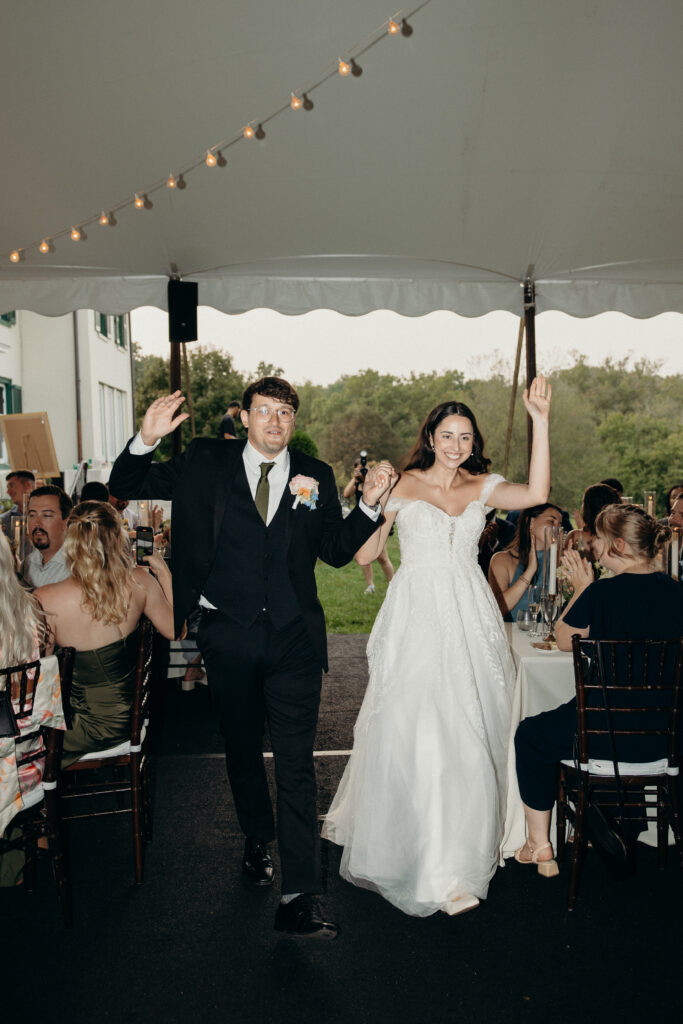 New York couple entering their wedding reception at The Willows