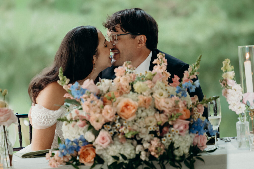 New York couple kissing at The Willows wedding reception