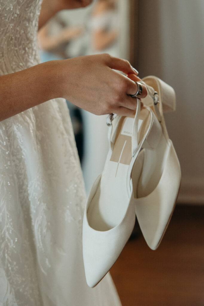 Bride holding her bridal shoes at The Willows in New York