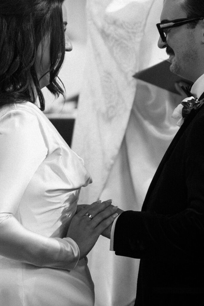 Couple holding hands at a New York church wedding