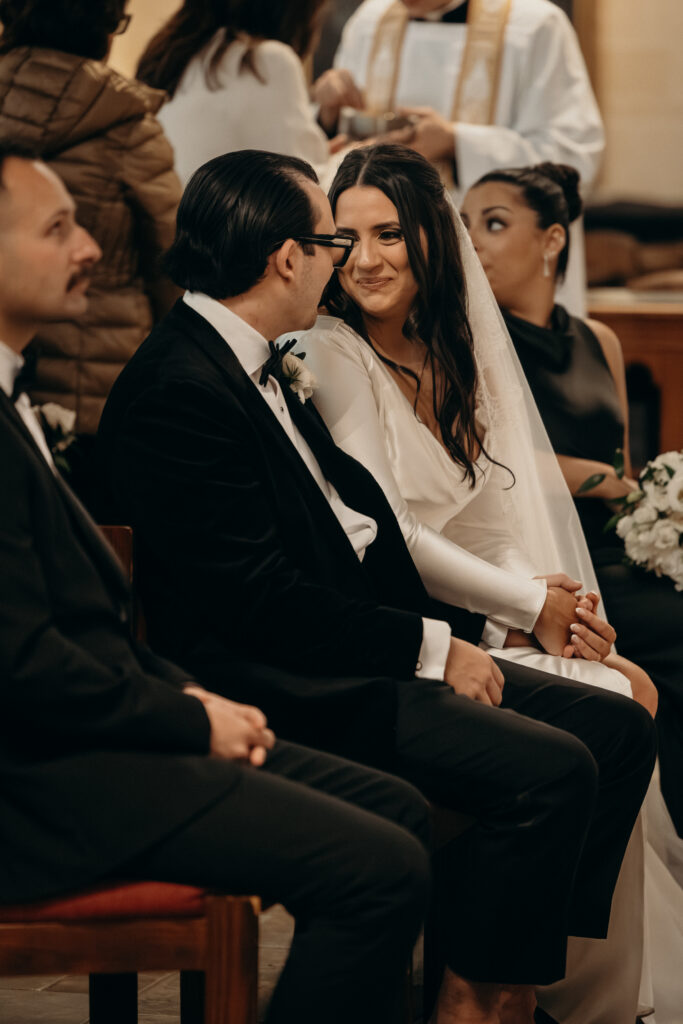Couple facing each other at a New York church wedding