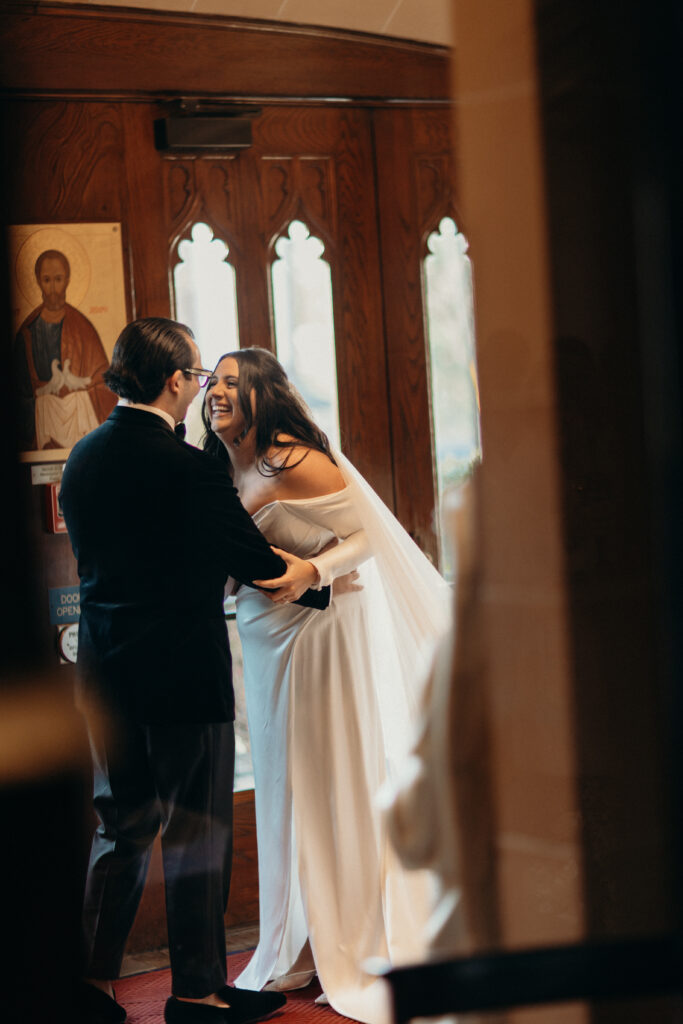 Couple candid moment at a New York church wedding