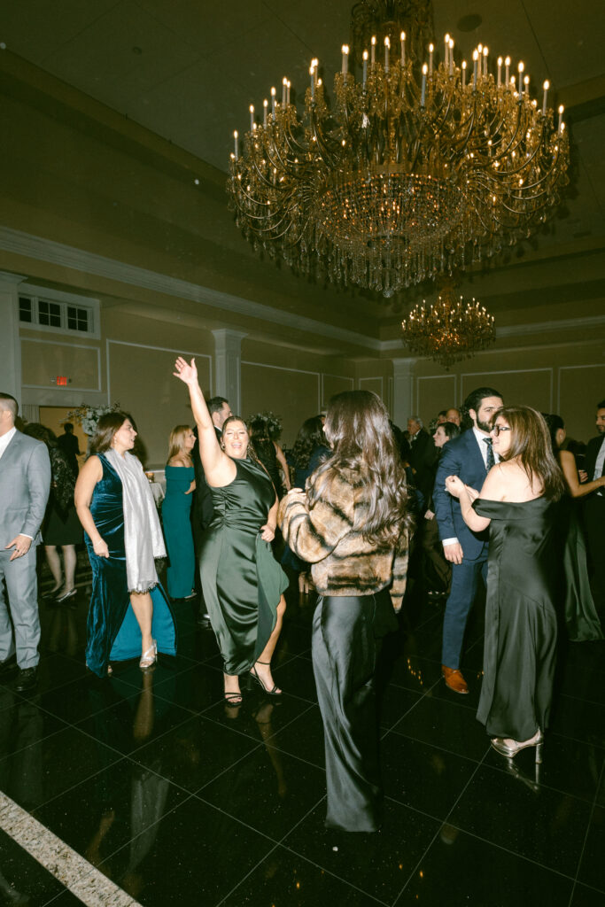 People partying at Le Chateau New York during wedding reception