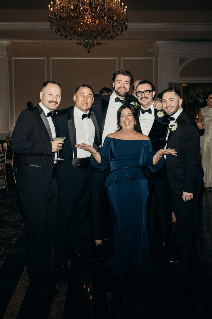 People posing at Le Chateau New York during wedding reception