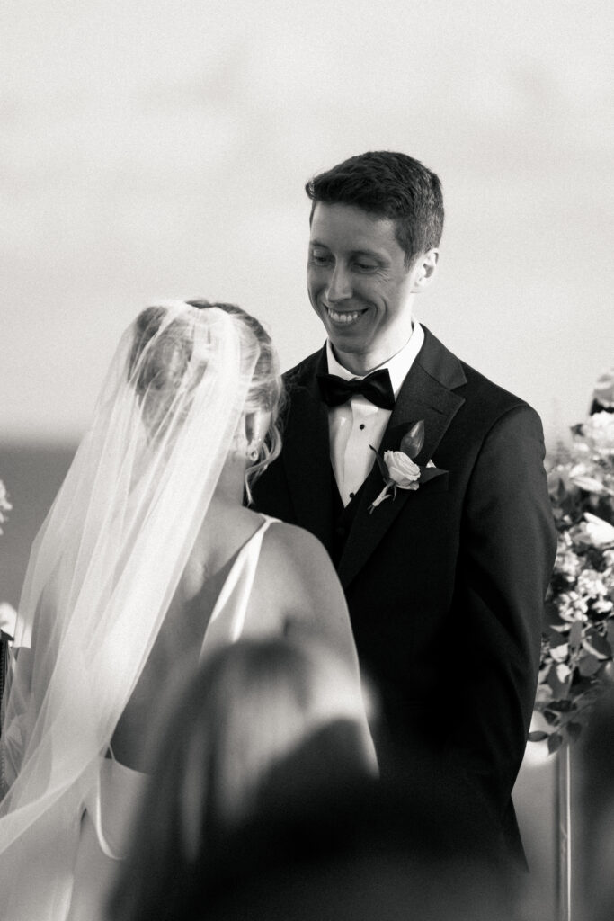 Groom smiling at his bride during The Asbury Hotel wedding ceremony