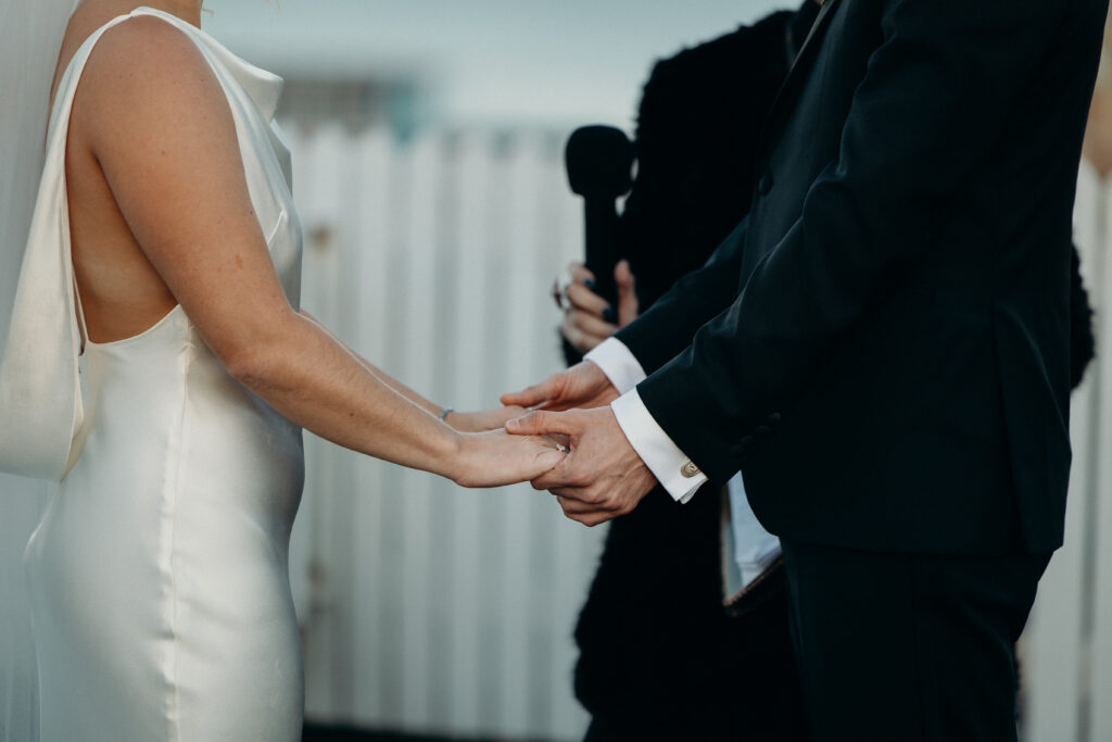 Bride and groom holding hands at The Asbury Hotel wedding ceremony
