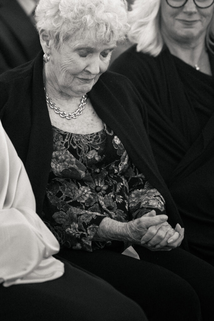 Grandmother praying at The Asbury Hotel wedding ceremony in Asbury Park