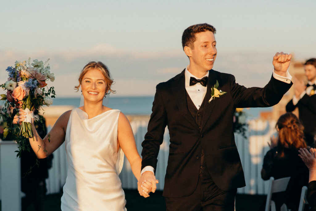 Bride and groom walking down the aisle at The Asbury Hotel wedding ceremony