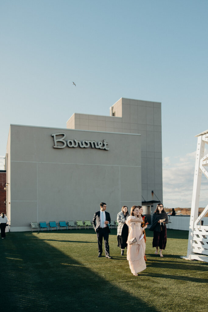Wedding guests arriving at the rooftop ceremony at The Asbury Hotel