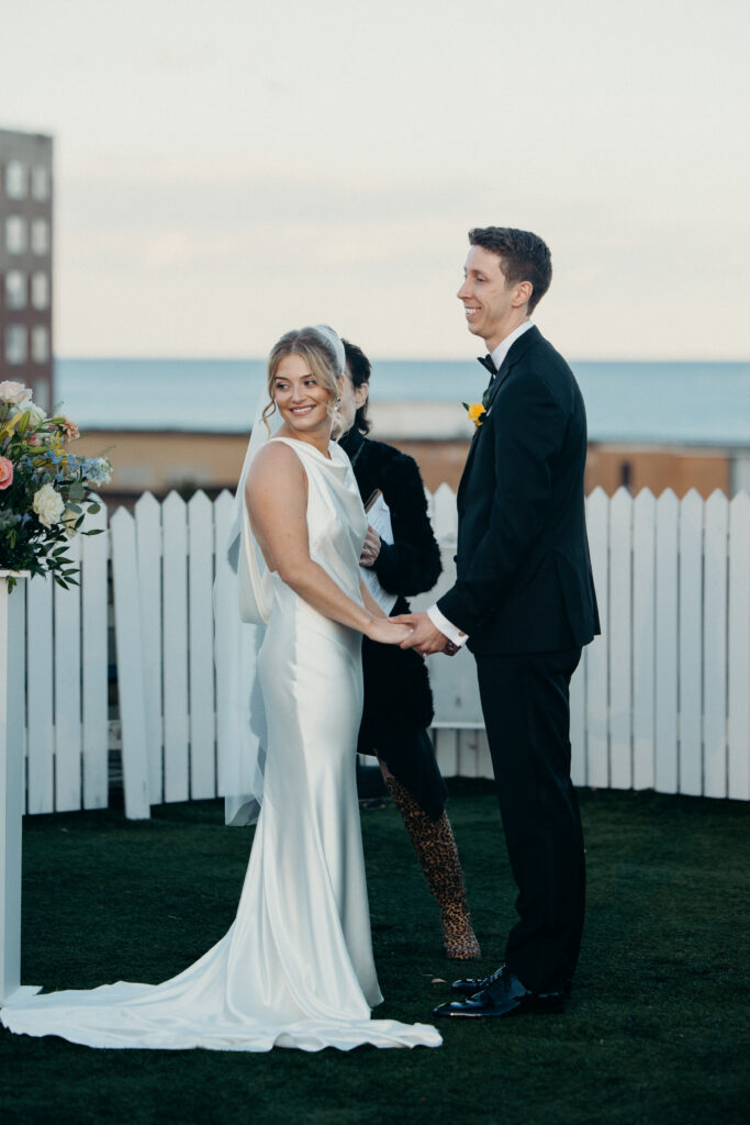 Couple sharing a reaction with guests at The Asbury Hotel wedding