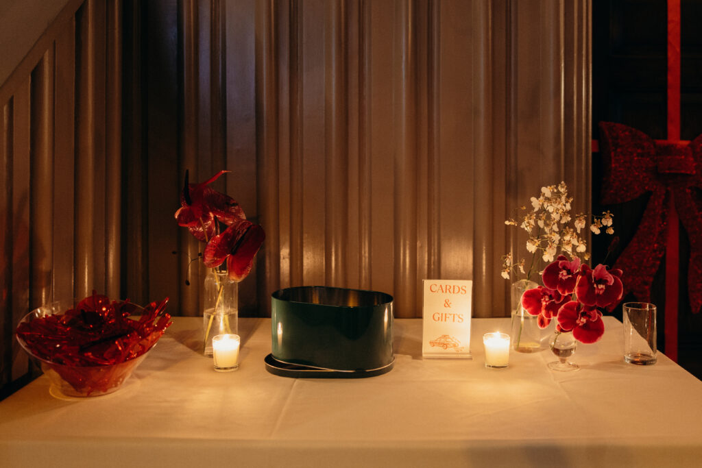 Wedding cards and gifts table with candles and florals