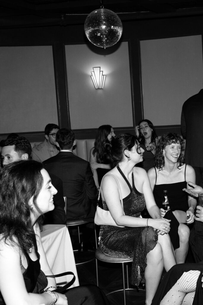 Guests mingling and chatting in a cozy reception lounge