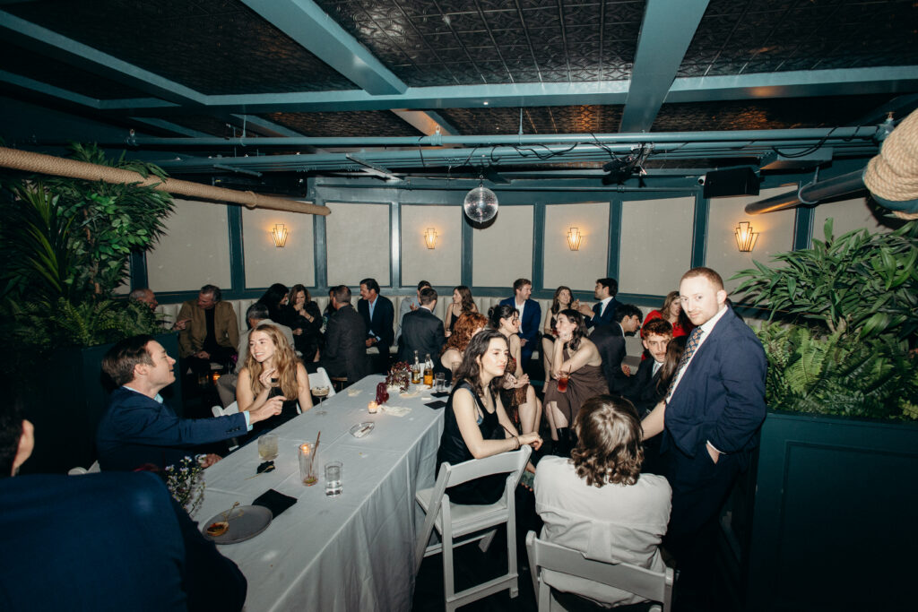 Reception room filled with guests celebrating together