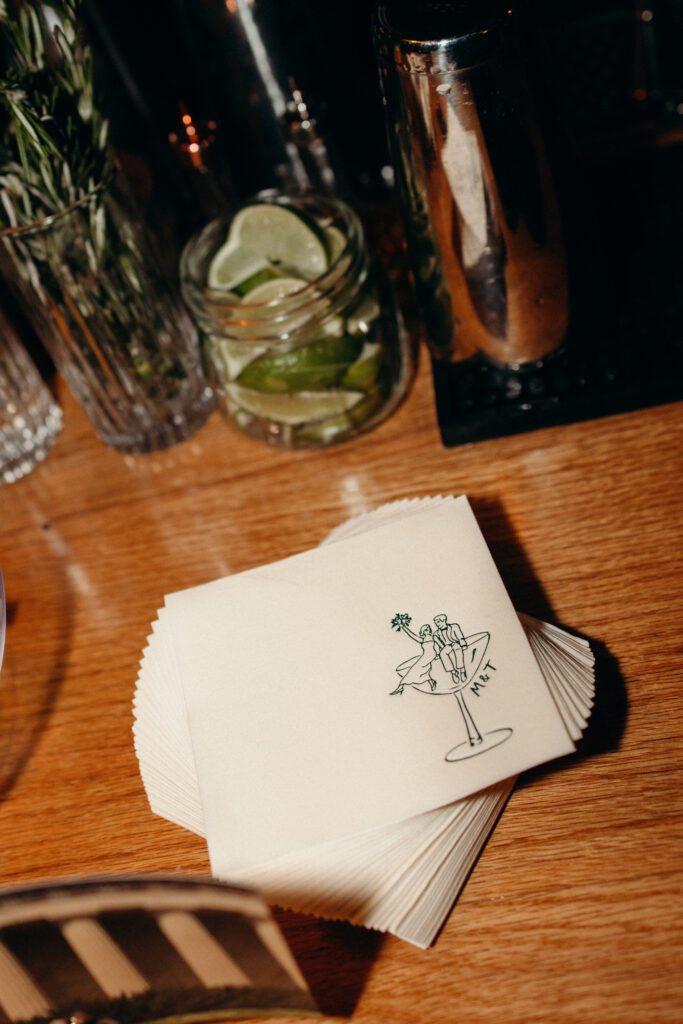 Cocktail bar setup with limes, herbs, and bar tools at Brooklyn wedding