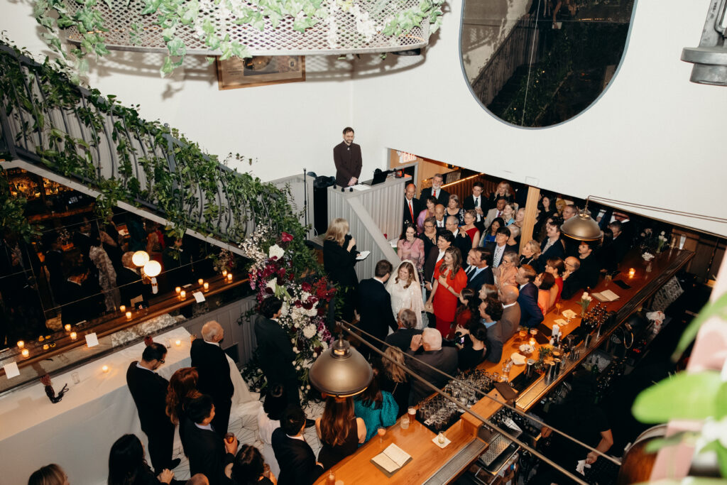 Overhead view of ceremony with guests gathered around at Madeline’s Brooklyn