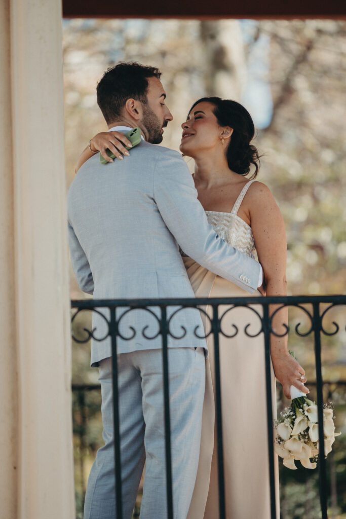 Sean and Giana’s intimate spring wedding ceremony at a gazebo surrounded by blooming trees in Jersey City