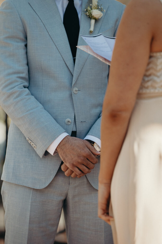 Bride and groom standing together at a gazebo during their intimate Jersey City wedding ceremony