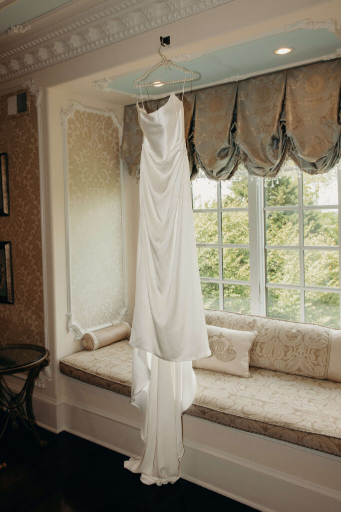 Bride's wedding dress hanging in the bridal suite at The Ashford Estate before Shay and Kevin's wedding