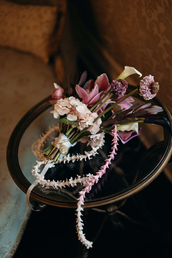 Bride's wedding bouquet with pink, burgundy, and white blooms at The Ashford Estate