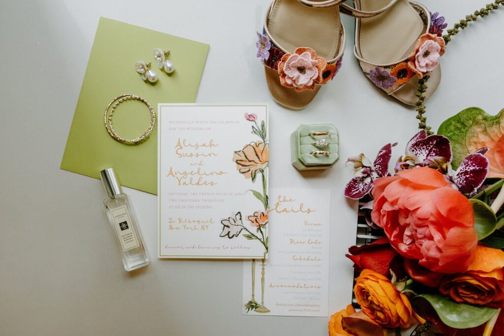 Wedding invitation and bridal details at Le Bilboquet, New York City