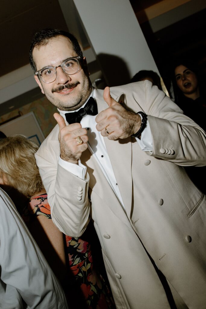Groom giving a thumbs-up at Le Bilboquet