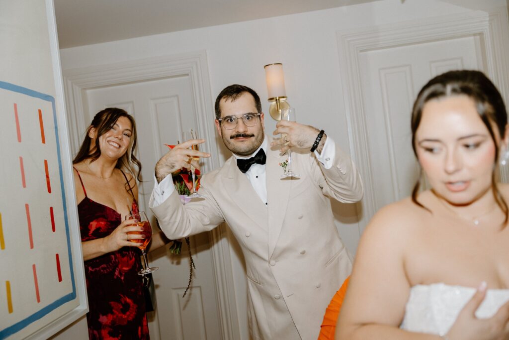 Bride and groom celebrating with champagne at Le Bilboquet
