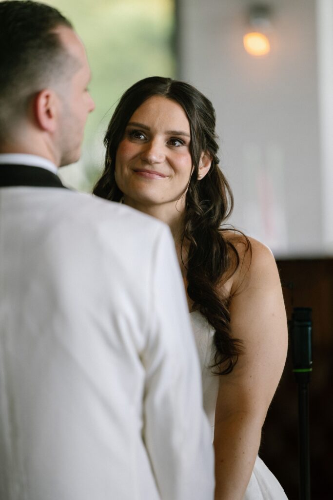 Bride looking at the groom during vows at Battello