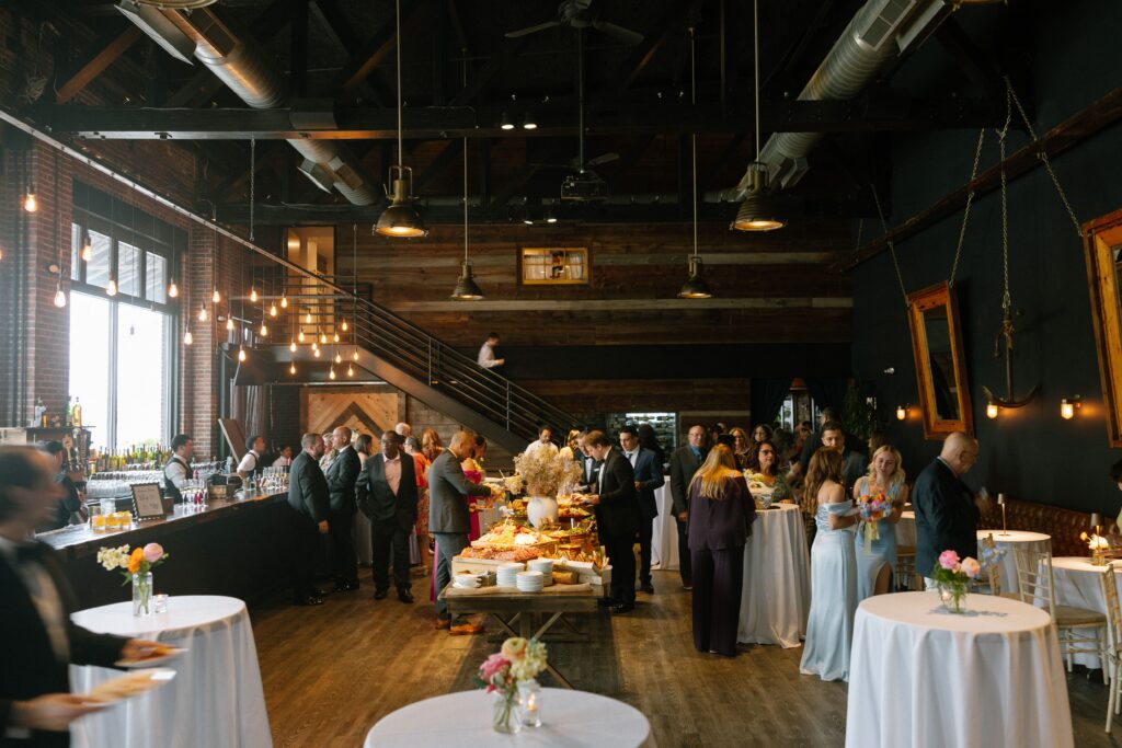 Guests socializing during cocktail hour at Battello