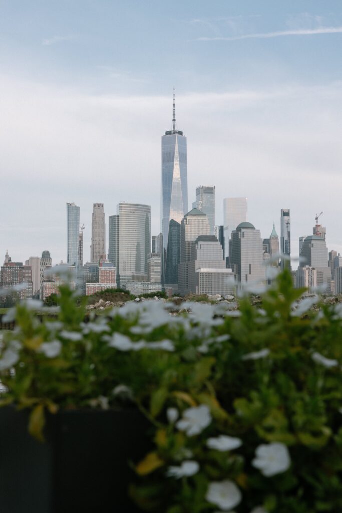 Scenic view of the New York City skyline framed by flowers at Battello